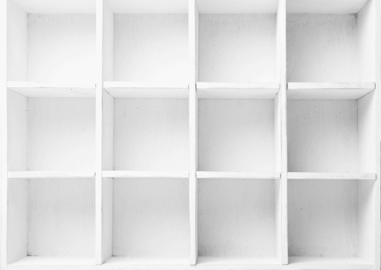 White bookshelf storage bins resembling a Kallax unit, featuring four square compartments arranged horizontally and three vertically.