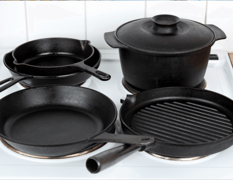 Assorted cast iron pots & dutch oven on a stovetop, showcasing a variety of shapes and sizes from a complete set, perfect for versatile cooking.