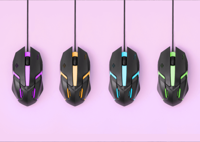 Four gaming mice lined up side by side, featuring vibrant colors: purple, orange, blue, and green, with their cables neatly positioned upwards.