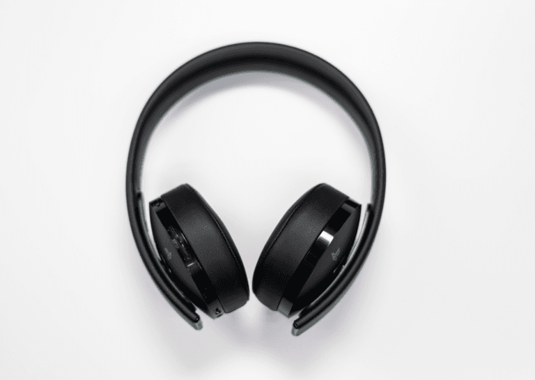 Black headphones viewed from the front against a white background, showcasing their sleek design and minimalist style.