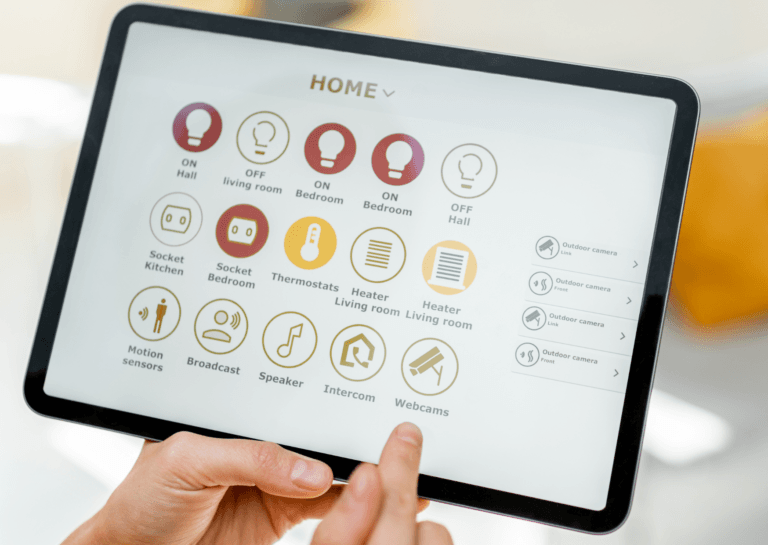 Close-up of a tablet screen displaying options for smart home devices, including icons for lighting, thermostat, motion sensors, and a living room heater.