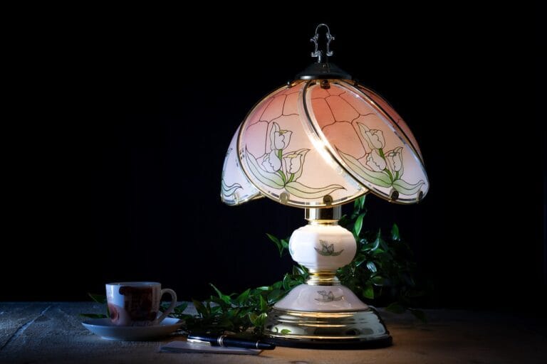 table lamp glowing in a dimly lit space with coffee at a, workplace in a warm ambiance