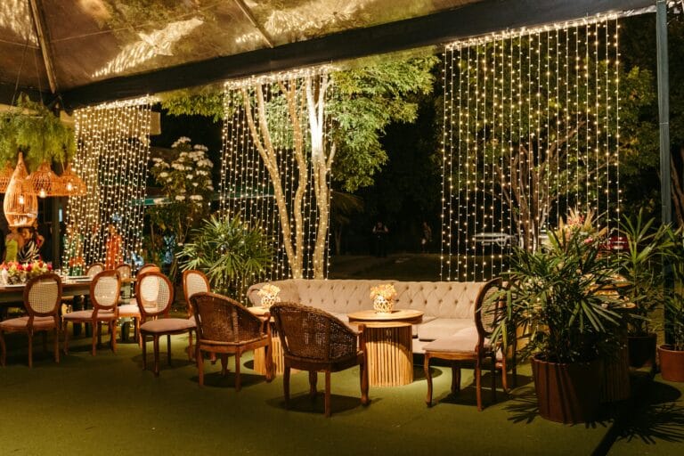 Chairs and Couch on Decorated Terrace at Night