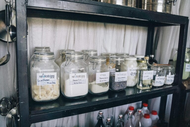 Clear Glass Jars on Black Shelf