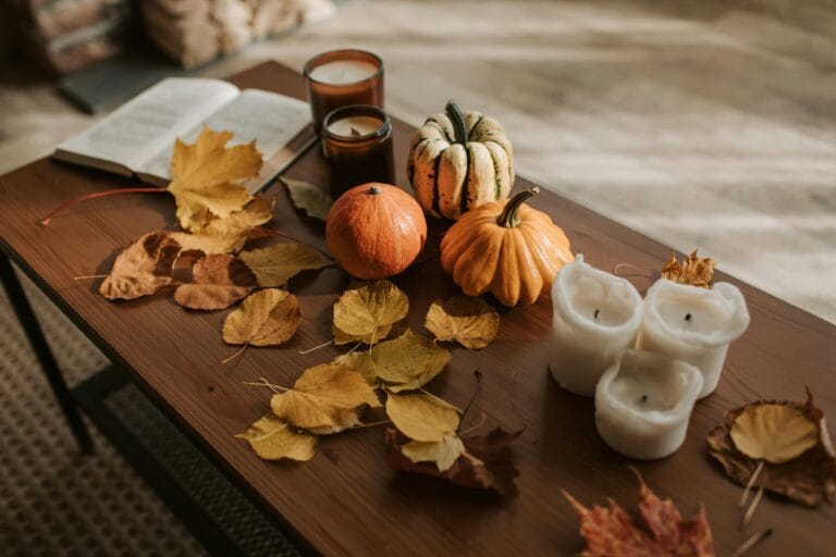 Pumpkins and Candles on the Table in autumn decor