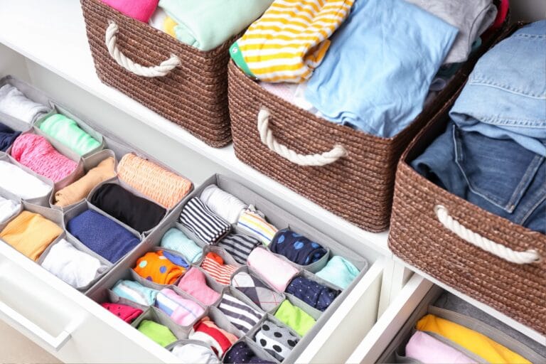 Closet organizer used for neatly sorting clothes in a wardrobe, with various compartments for efficient storage.